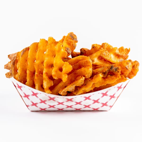 A red and white checkered paper tray filled with golden-brown waffle fries.